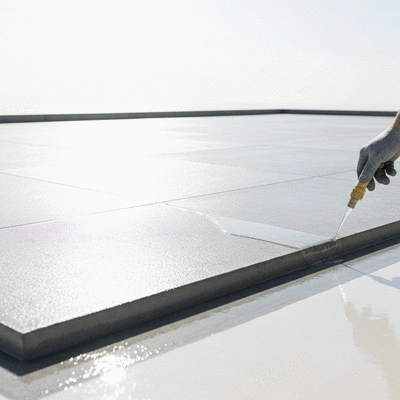 Concrete installation with a protective sealant being applied