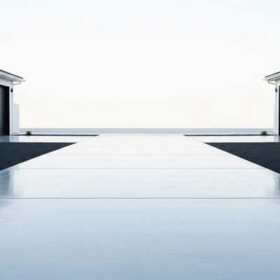 Concrete driveway installation with modern finish